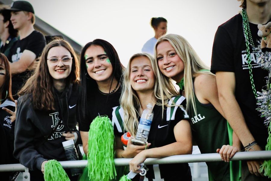 (Left to right) Seniors Chanel Henning, Jessa Larson, Lauren Dull, and Lily Bland smiling at the homecoming game