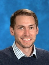 Newly elected Catholic School System president Andrew McDonald smiling for his picture 