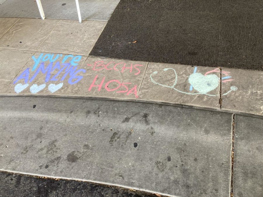 Chalk art by BCCHS HOSA members in the Billings medical corridor.