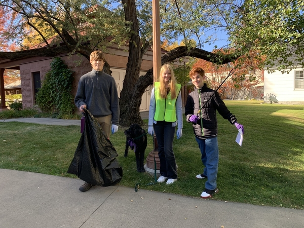 9th graders helping pick up trash around the neighborhood near BCCHS