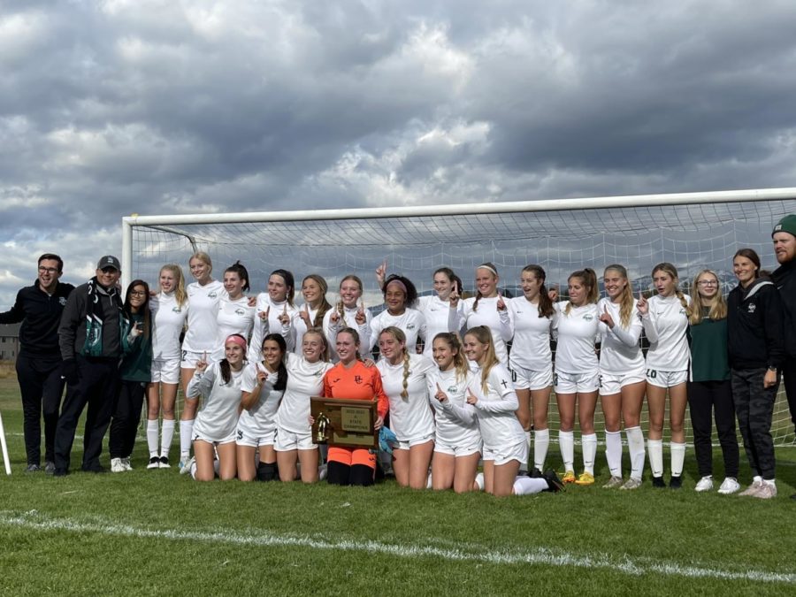 Billings Central Girls Soccer team posing with the 1st place trophy after winning the state championship