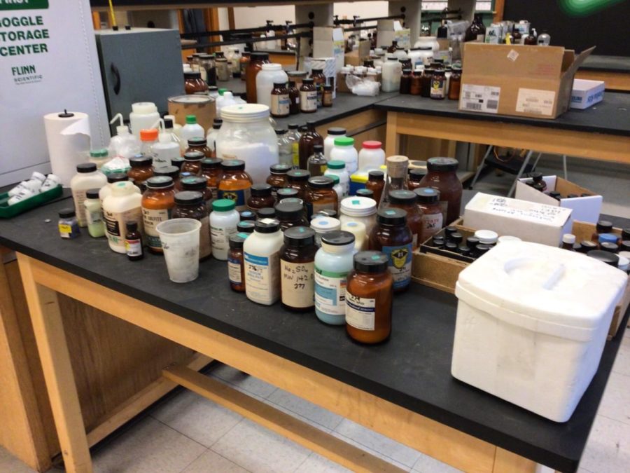 Chemicals in the BCCHS chemistry lab being sorted and awaiting disposal.