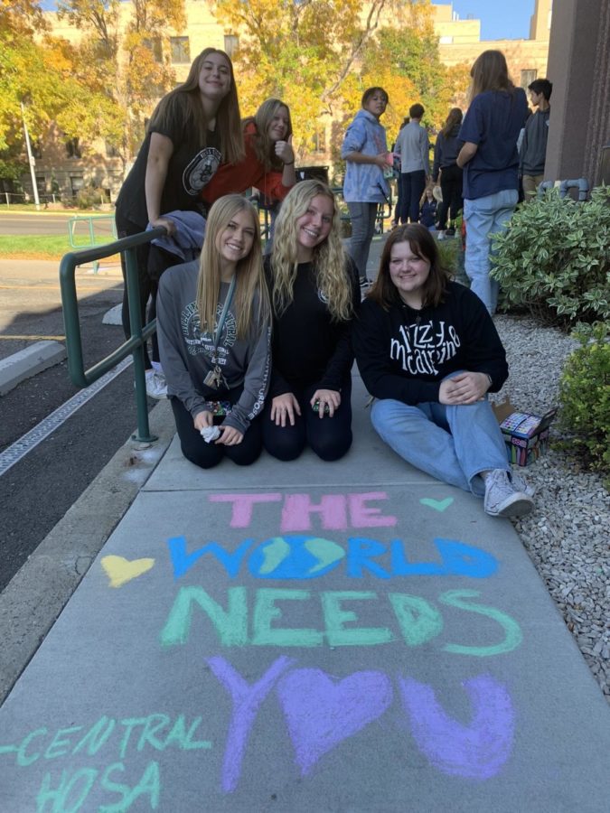 BCCHS HOSA members posing for a photo at the chalk art event. 