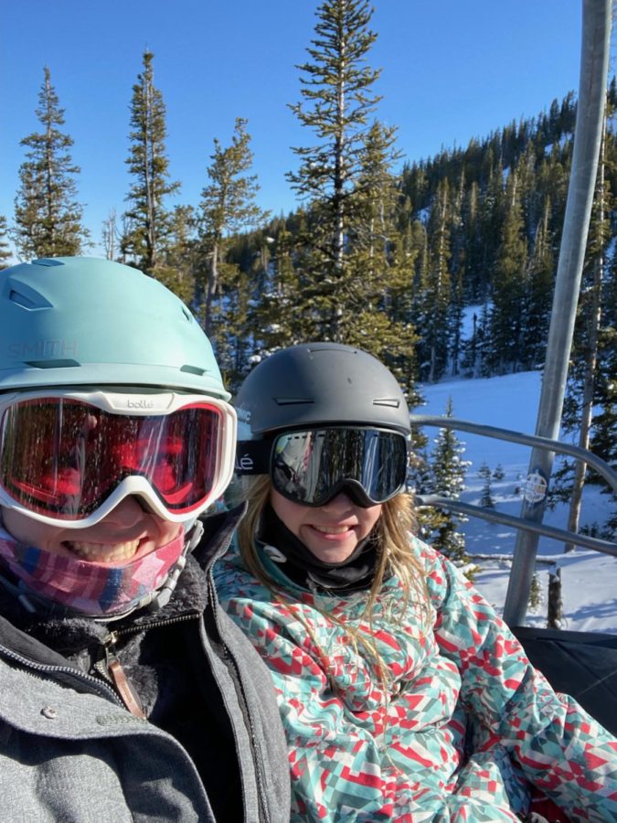 Junior Evie Reck (left) on a chairlift with her sister at Red Lodge.