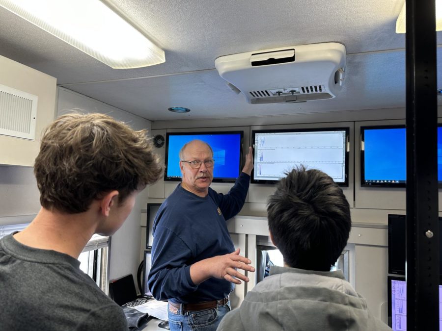 EPA Chemist Dave Mickunas explaining the data shown on charts in the Trace Atmospheric Gas Analyzer (TAGA).