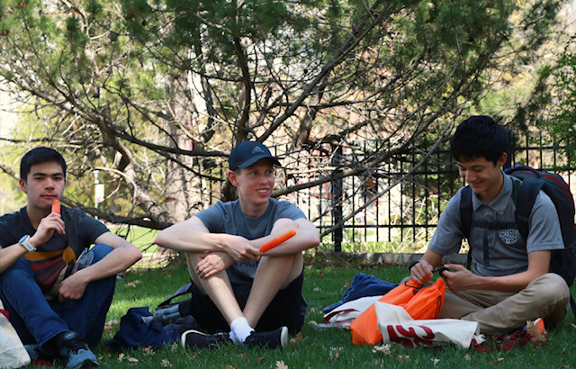 Central students cool down in the shade with popsicles before their tour of the University of Montana.