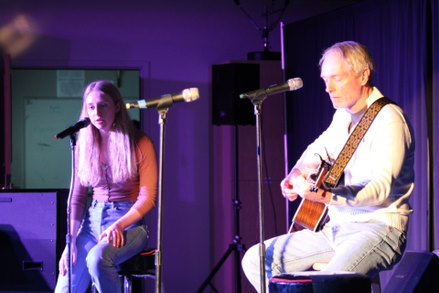 Senior Alyson Early singing accompanied by her dad