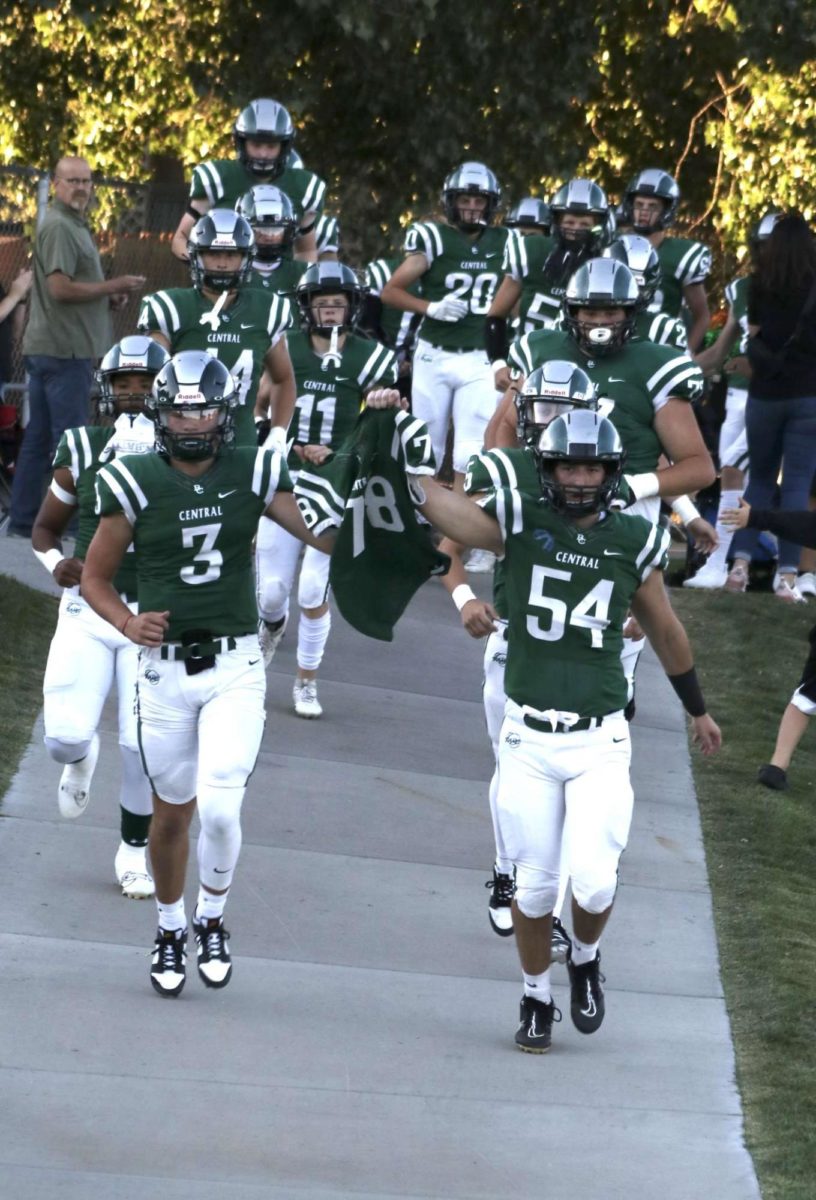 Seniors Adam Balkenbush #3 and Maddox Roberts #54 carry down Collin Messers jersey before the homecoming game 