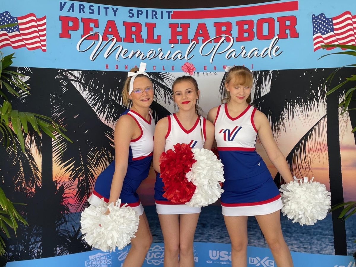 12.7.2023  Kayden Soucy, Isabelle  Desmarais and Cyann Crabtree(left to right)  posing for a picture at the 82nd Pearl Harbor Memorial Parade 