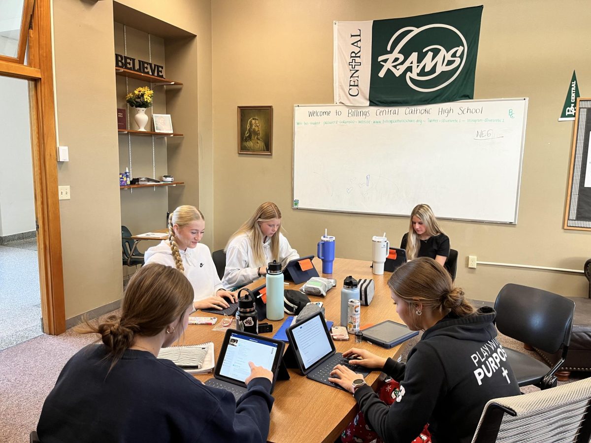 A group of 10th graders use the upper conference room to work during a refocus study hall period. 