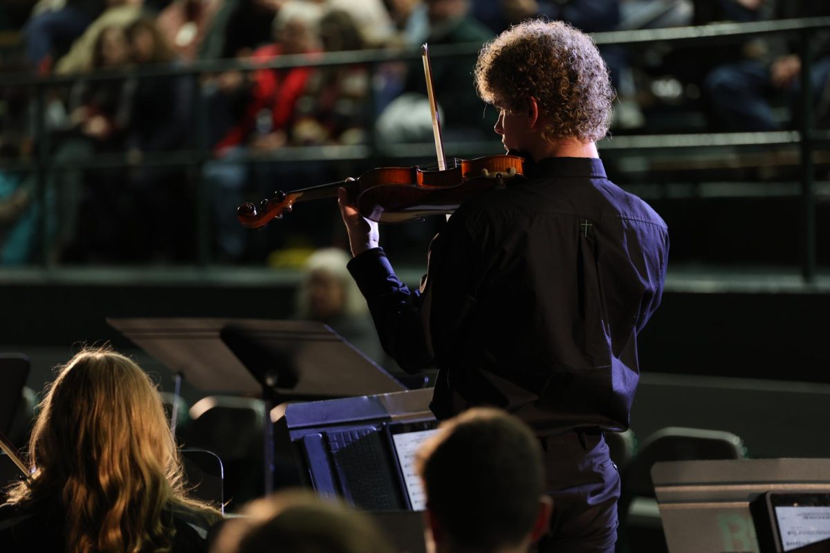 12.13.2023 Sophomore Alex Johnson playing violin at the Christmas Cantata.