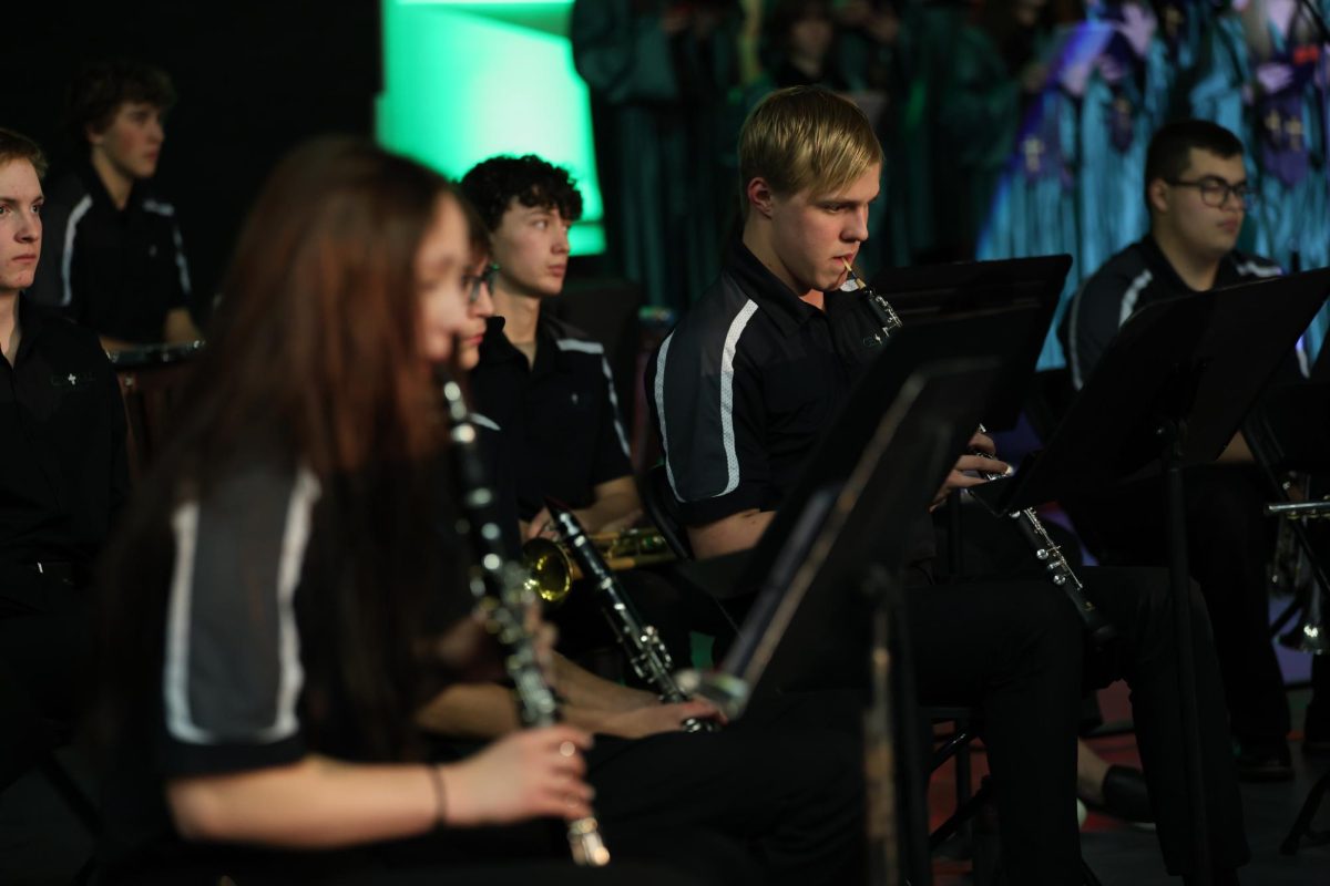 12.13.2023 Senior Aedan Hraban(right) performing a duet with sophomore  Joanne Ragsdale(left) during the Cantata  