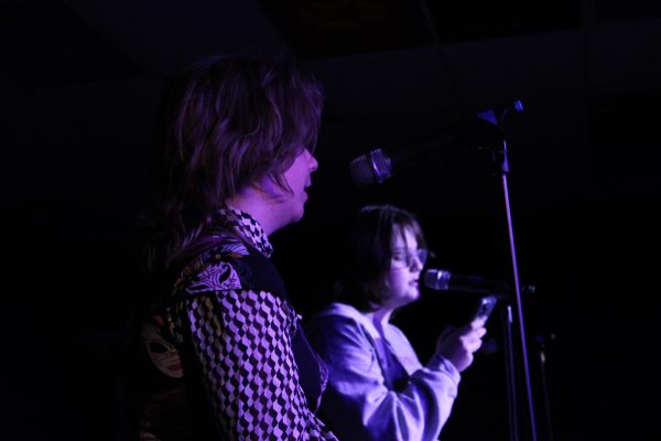 10.27.23 Sophomores Zoie Weston(left) and Nora Zeier(right) preform together at Open Mic Night 