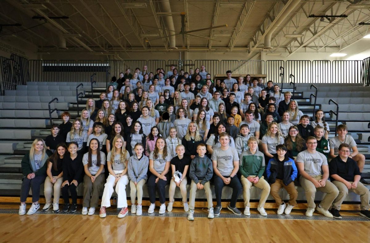 11.21.2023 Juniors and seniors of the KCK Program sit for a picture with their 5th grade buddies at All System Mass. 