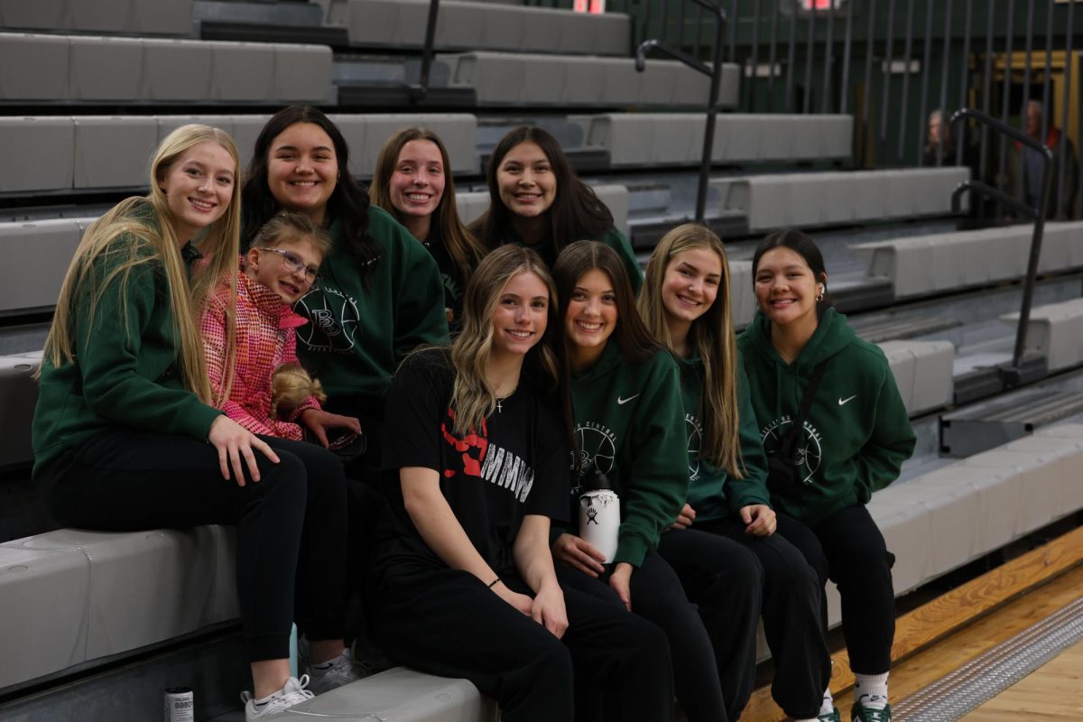1.4.24. Girls basketball team with a supporting fan.