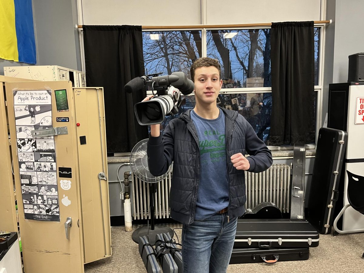 2.13.24. Janko Lakovic holding a camera in film class.