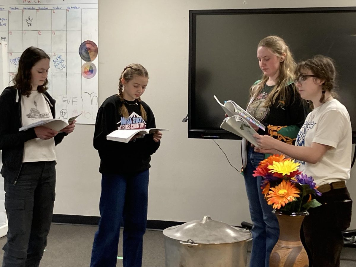 1.30.24 Sophie Hall, Olivia Guenther, Halle Anderson, and Julia Reger-Brown memorizing lines.