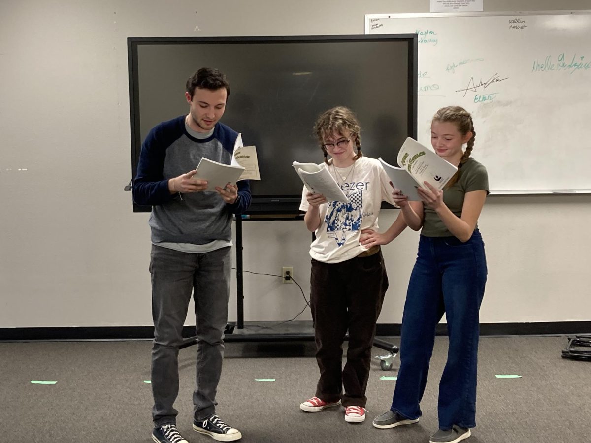 1.30.24 Aidan O’Neill, Julia Reger-Brown and Olivia Guenther memorizing their lines.