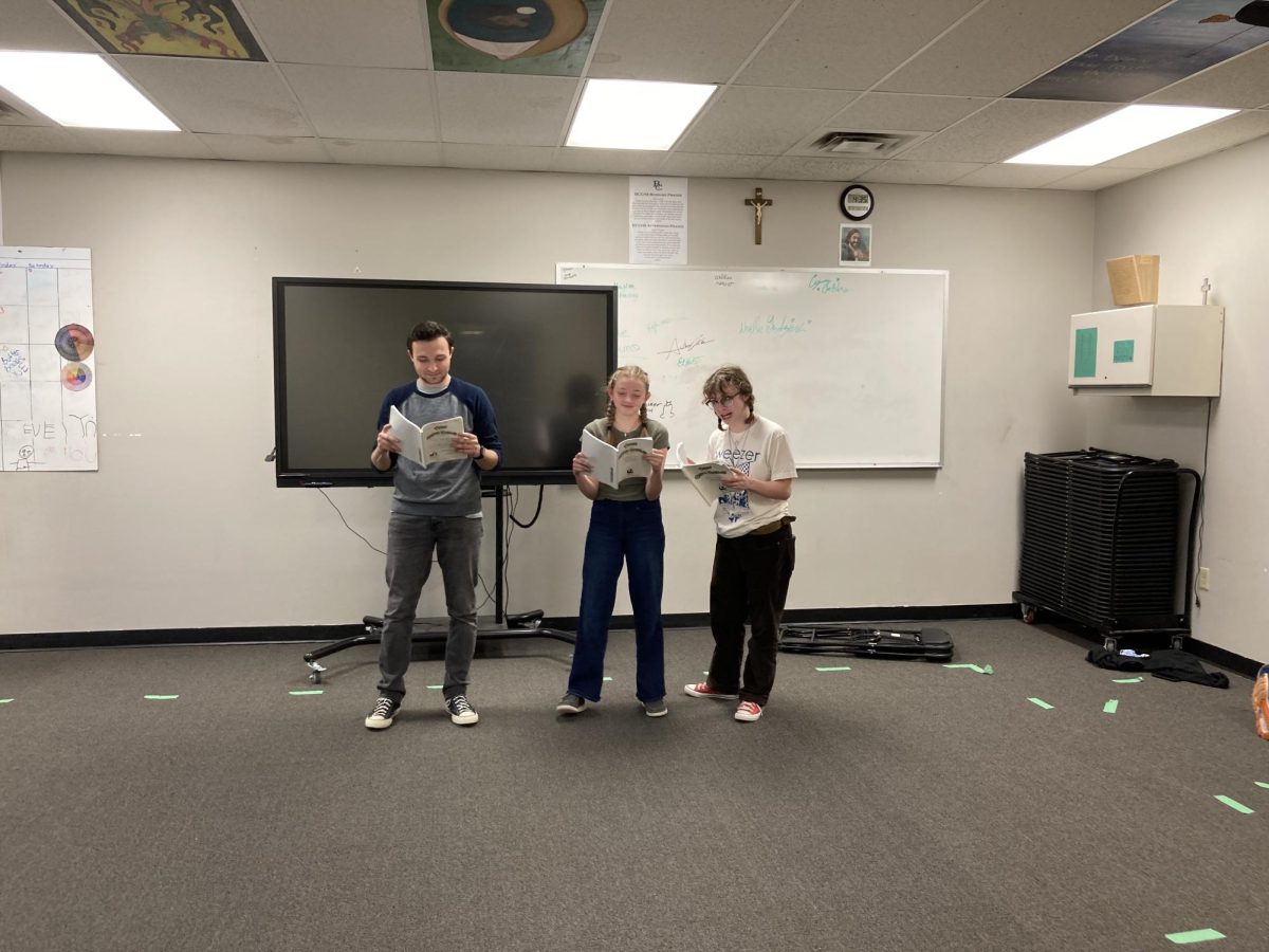 1.30.24 Aidan O’Neill, Julia Reger-Brown, and Olivia Guenther memorizing lines.