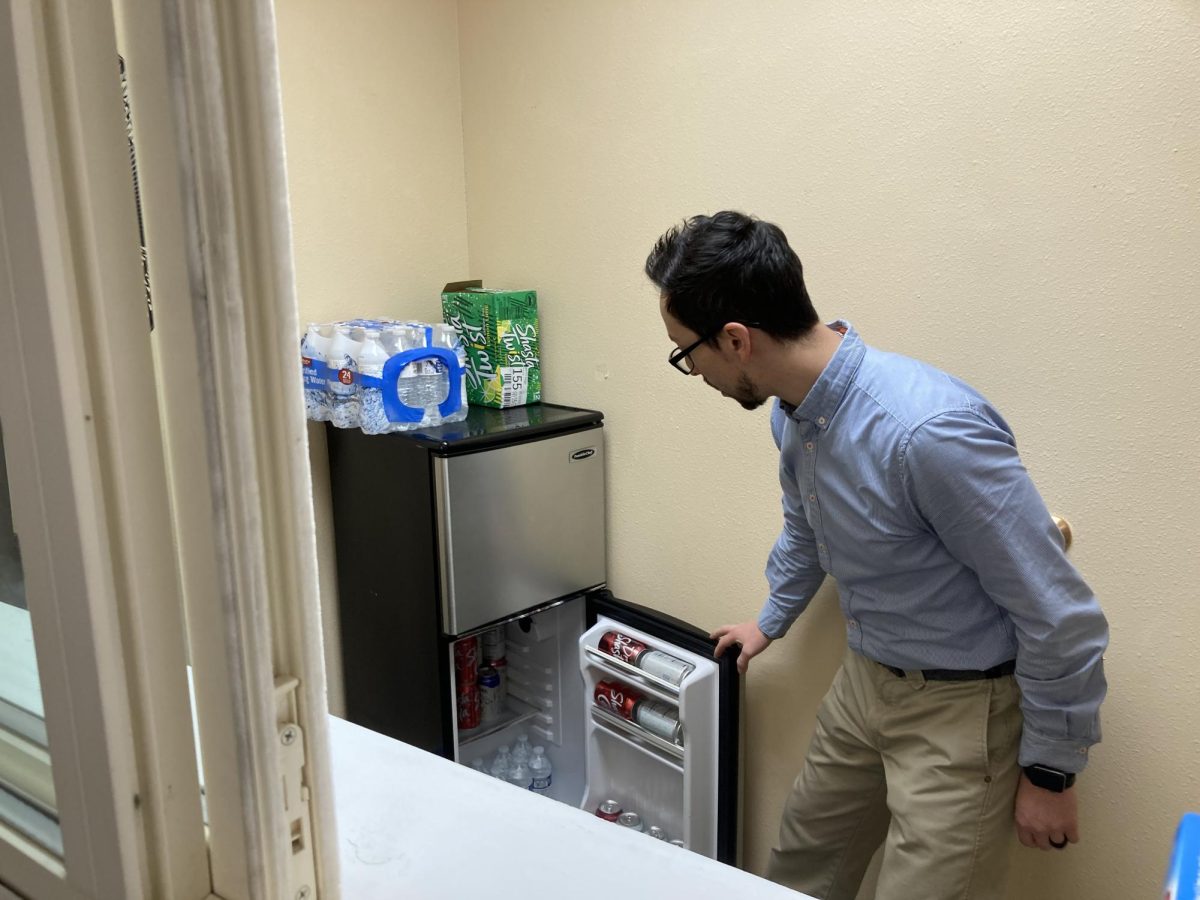 Mr. Martinez showing the inside of the fridge in the snack room 2.29.24