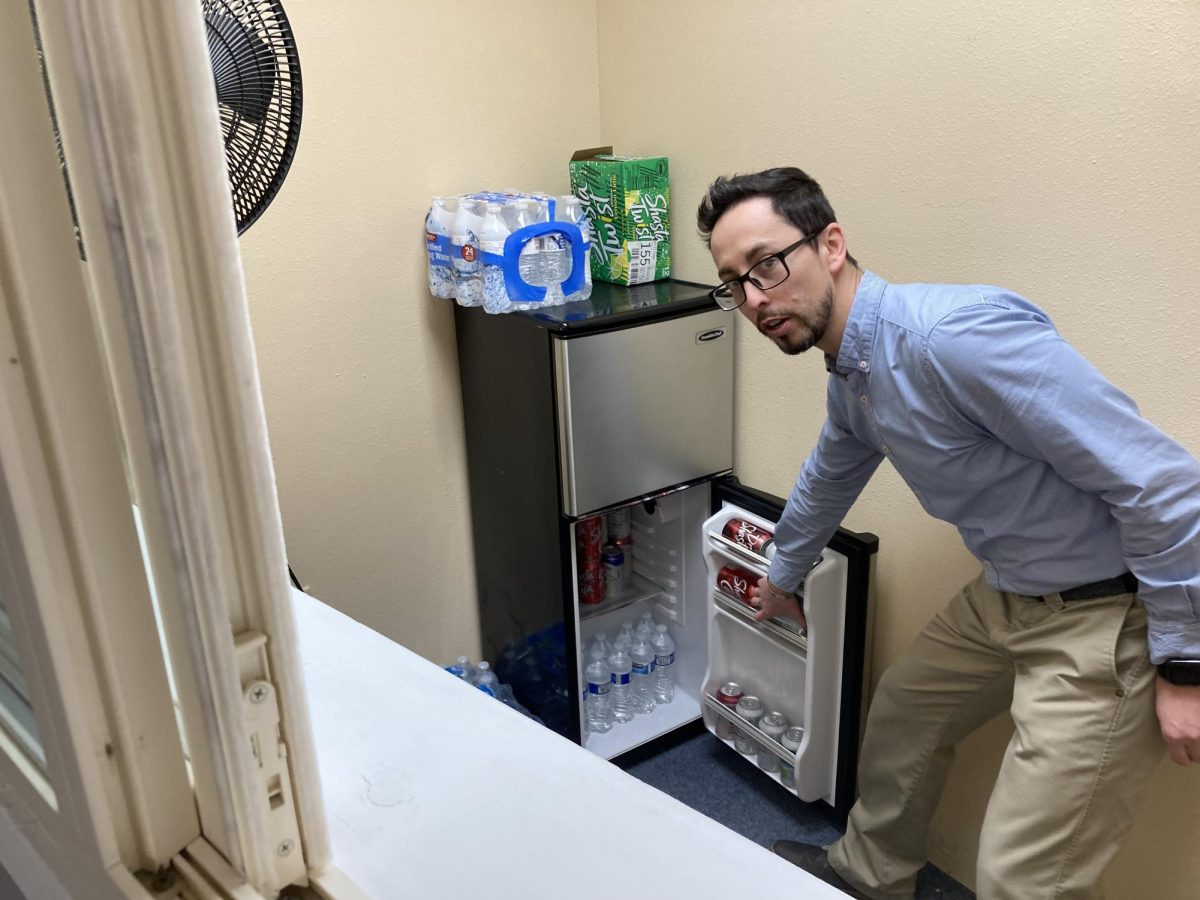 Mr. Martinez showing the inside of the fridge in the snack room 2.29.24