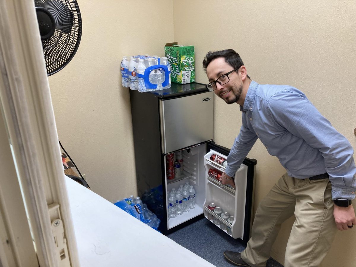 Mr. Martinez showing the drinks in the snack room 2.29.24