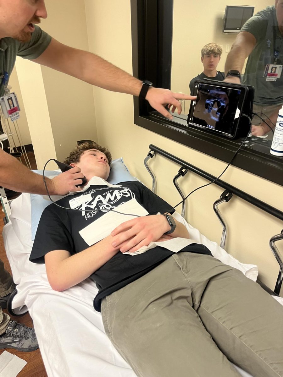 3/27/2024 Senior, Jack Milroy undergoing an ultrasound on his neck as LPN shows the difference between blood vessels and arteries. 