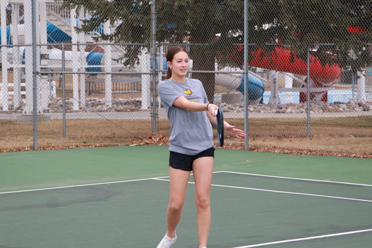 3/12/2024 Sophomore Teaghan Vaira hitting a forehand. 