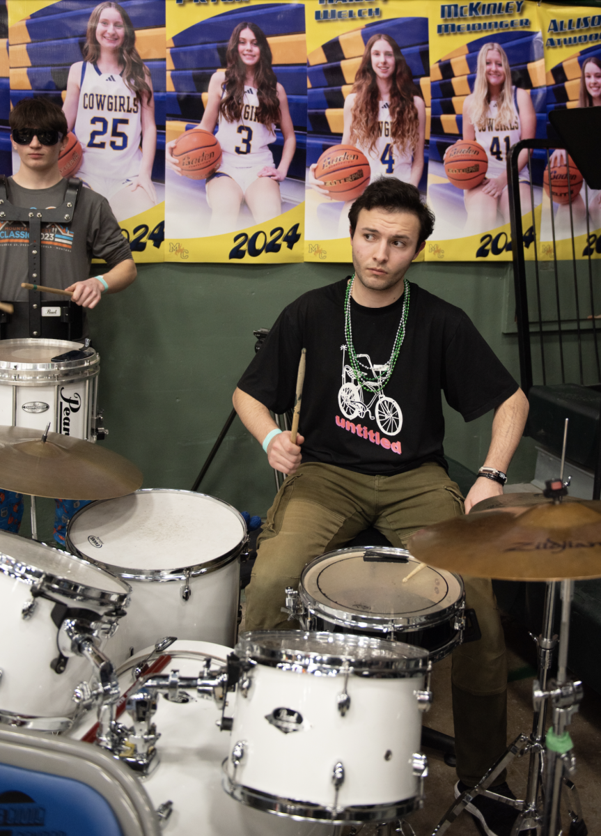 3.7.24 Senior Aidan O’Neill playing the drum set at the girls basketball game against Frenchtown in Butte.