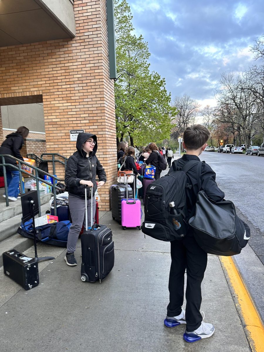 5.9.24 The freshman boys gather their items and prepare to board the bus. 