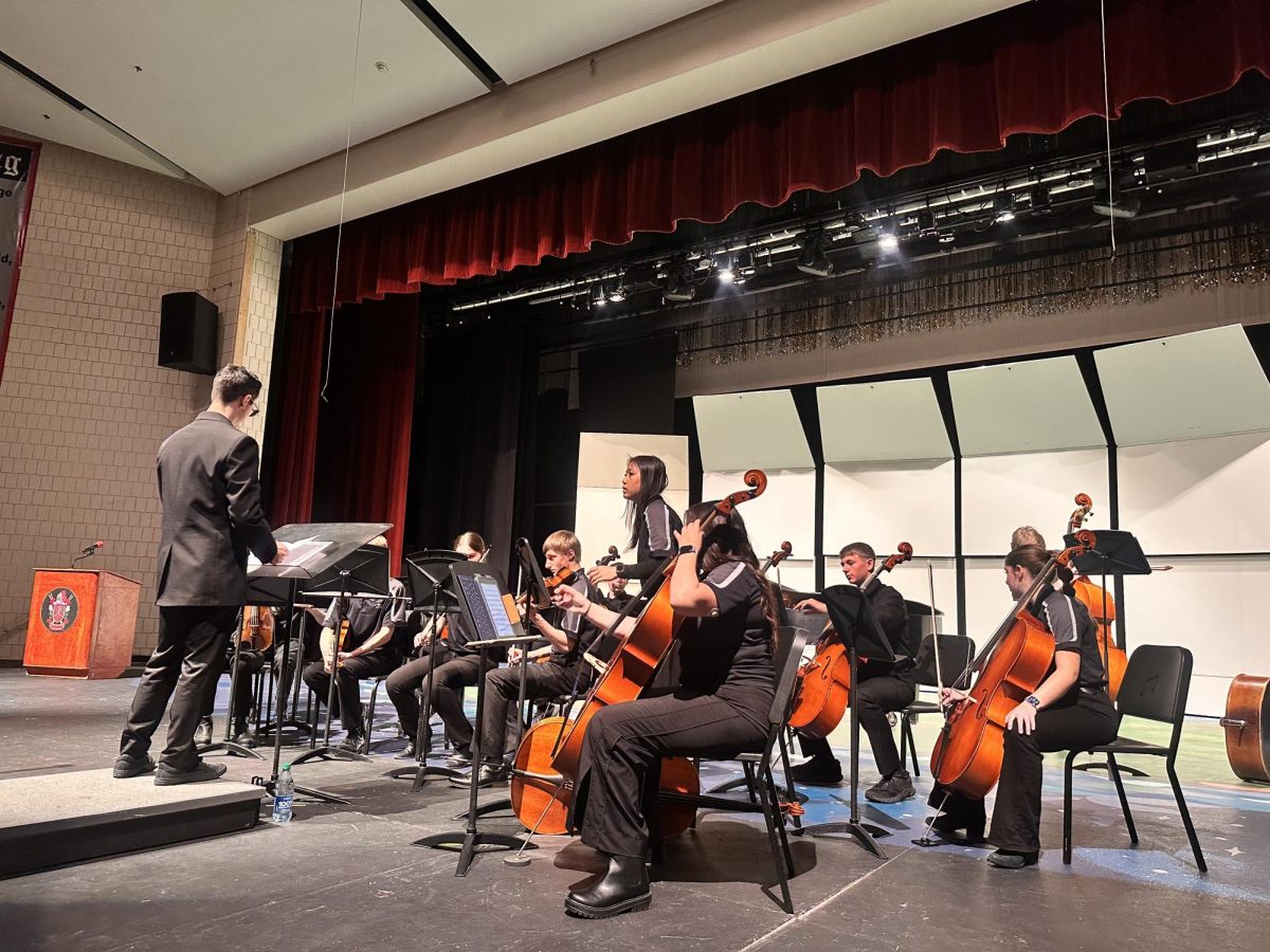 5.11.24 Mr.Martinez prepares the orchestra for their adjudication. 