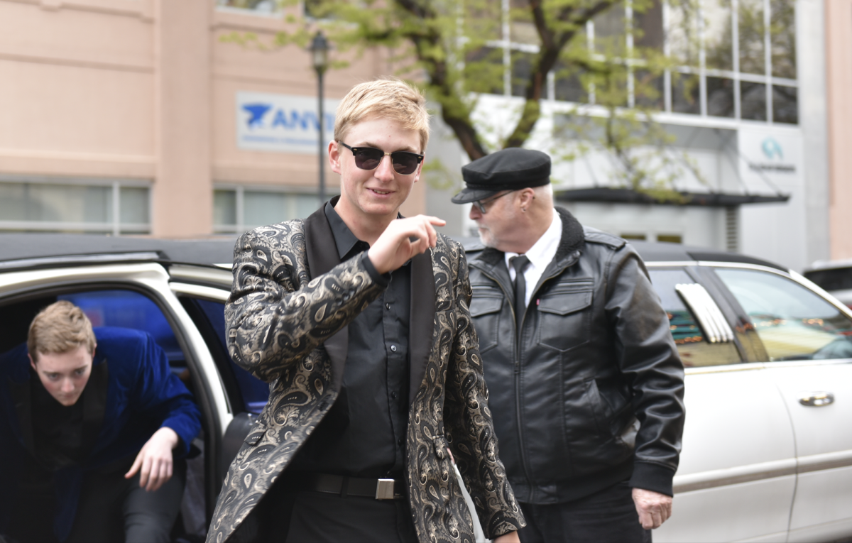 5.8.24 Senior David Ramshaw waves to the camera as he walks into the Babcock Theatre. 