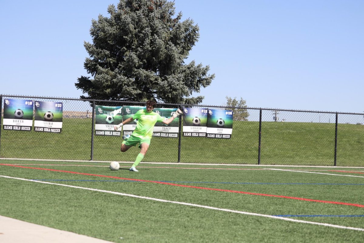 8.31.24 Junior goalkeeper Logan Hutzenbiler takes a free kick during the boys varsity soccer game against Whitefish 