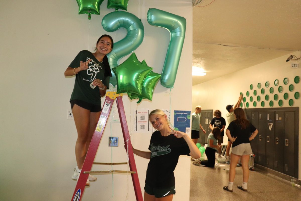 9.8.24 Sophomores (L to R) Lizzie Rah and Avery Sorensen help decorate sophomore hall for homecoming week.