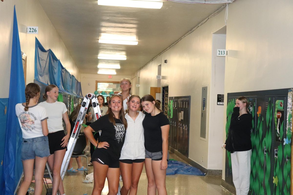 9.8.24 Freshmen (L to R) Emerson Dull, Maggie Baker, Chloe Hamilton help decorate freshman hall for homecoming week.