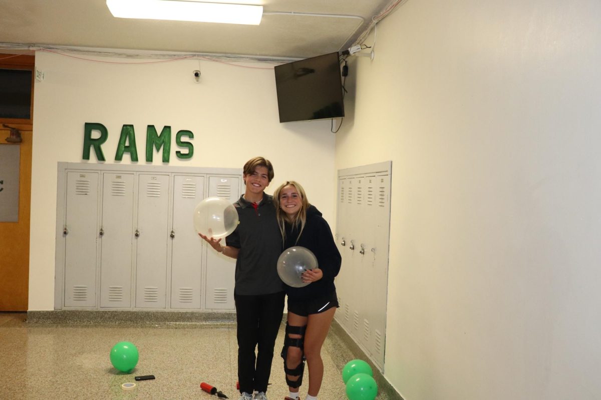 9.8.24 Juniors (L to R) Maclayn Clark and Kage Boyles posing for a picture during the homecoming hallway decorating.