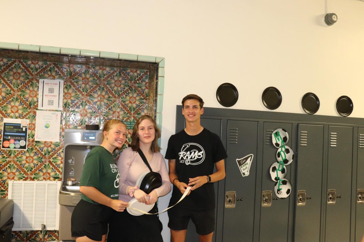 9.8.24 Seniors (L to R) Kiya Ford, Margot Brailer, and Evan Miller posting for a picture during their last homecoming hallway decorating.