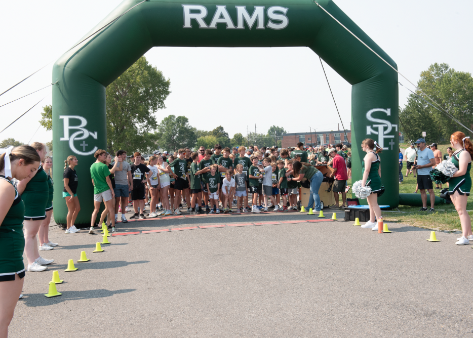 9.8.24 Runners line up at the starting line, awaiting the buzzer. 