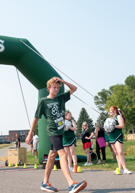 9.8.24 8th grade McKade Vaira crossing the finish line first out of 218 people. 