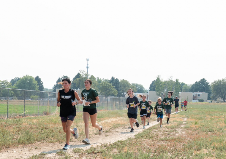 9.8.24 Billings Catholic Schools parents and students running the Running on Faith race. 