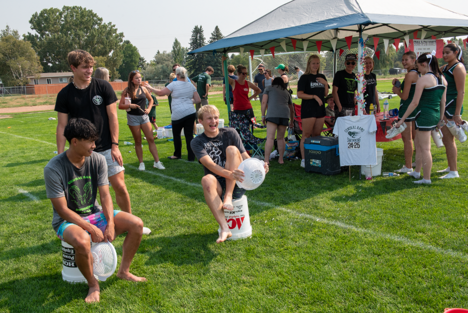 9.8.24 Senior Luke Pankratz trying to keep himself from getting soaked at the swimming booth. 