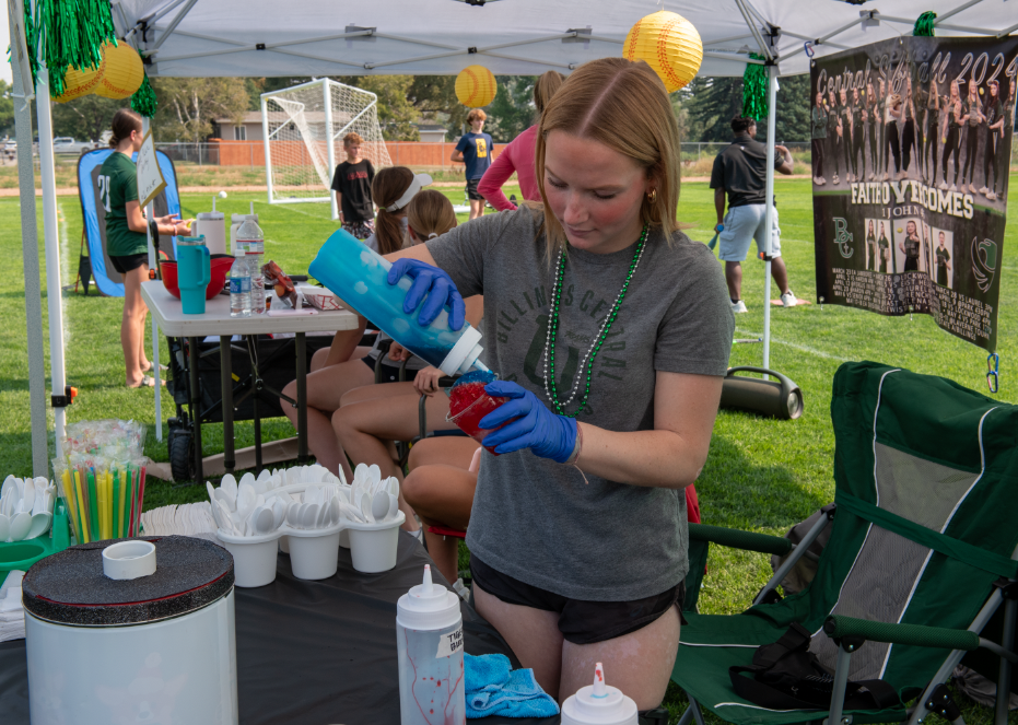 9.8.24 Sophomore Carlee Hofer making a slushie for the Softball booth.