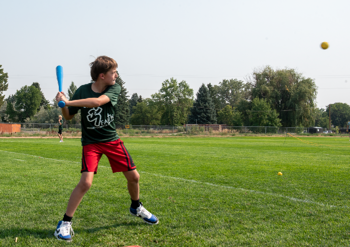 9.8.24 Cole Ramlow hits a ball at the baseball booth. 