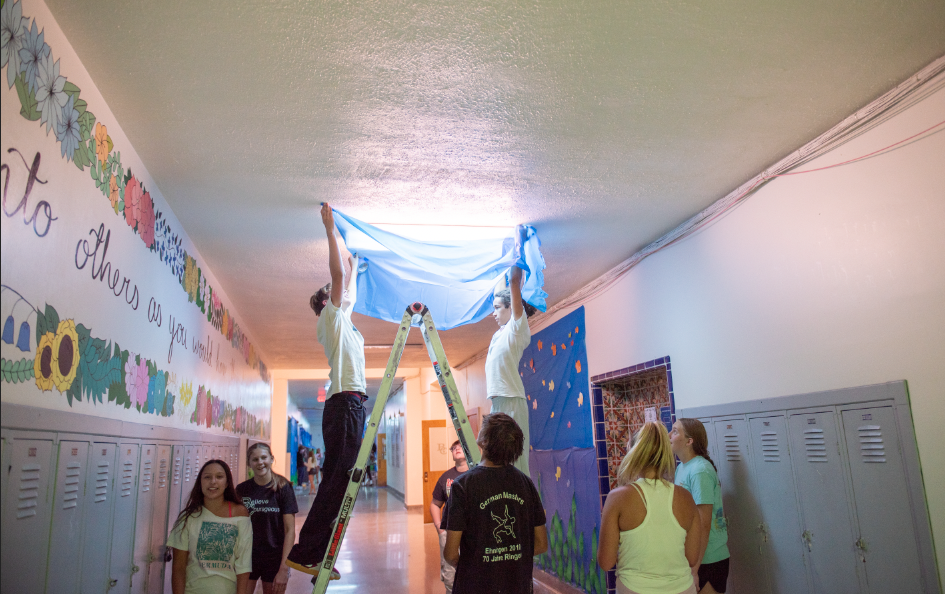 9.8.24 Central students changing the color of the lights while decorating for Homecoming. 