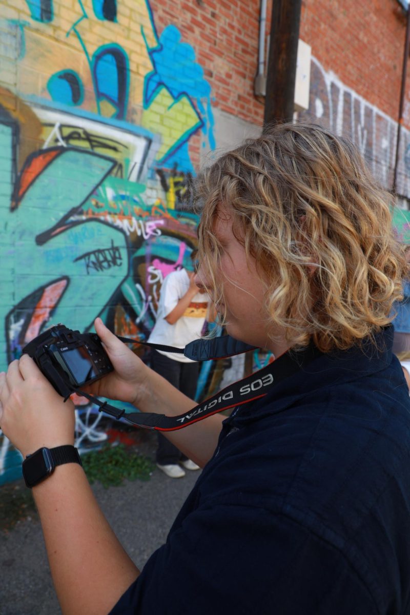 (For Social Media) 8.28.24 
Senior Ellis Tillery looking at the photos he’s taken. 