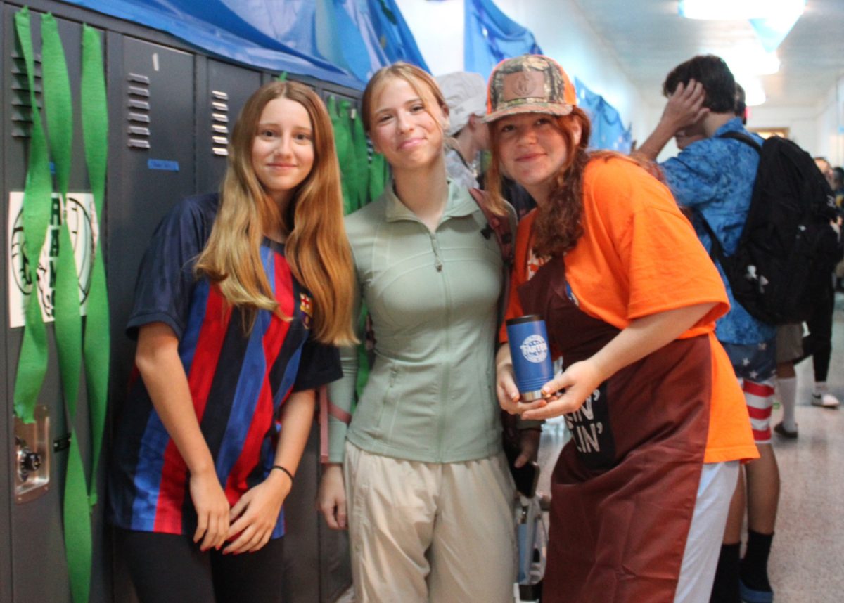 9.10.24 (From L to R) Freshmen Claudia Naranjo, Delia Whitcomb, and Reata Limpp on BBQ Dads vs. Soccer Moms Day. 