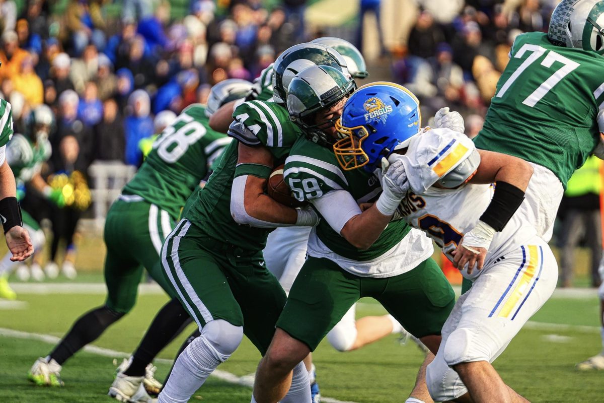 11.16.24 Junior Jordan Harrell blocking a Fergus player. 
