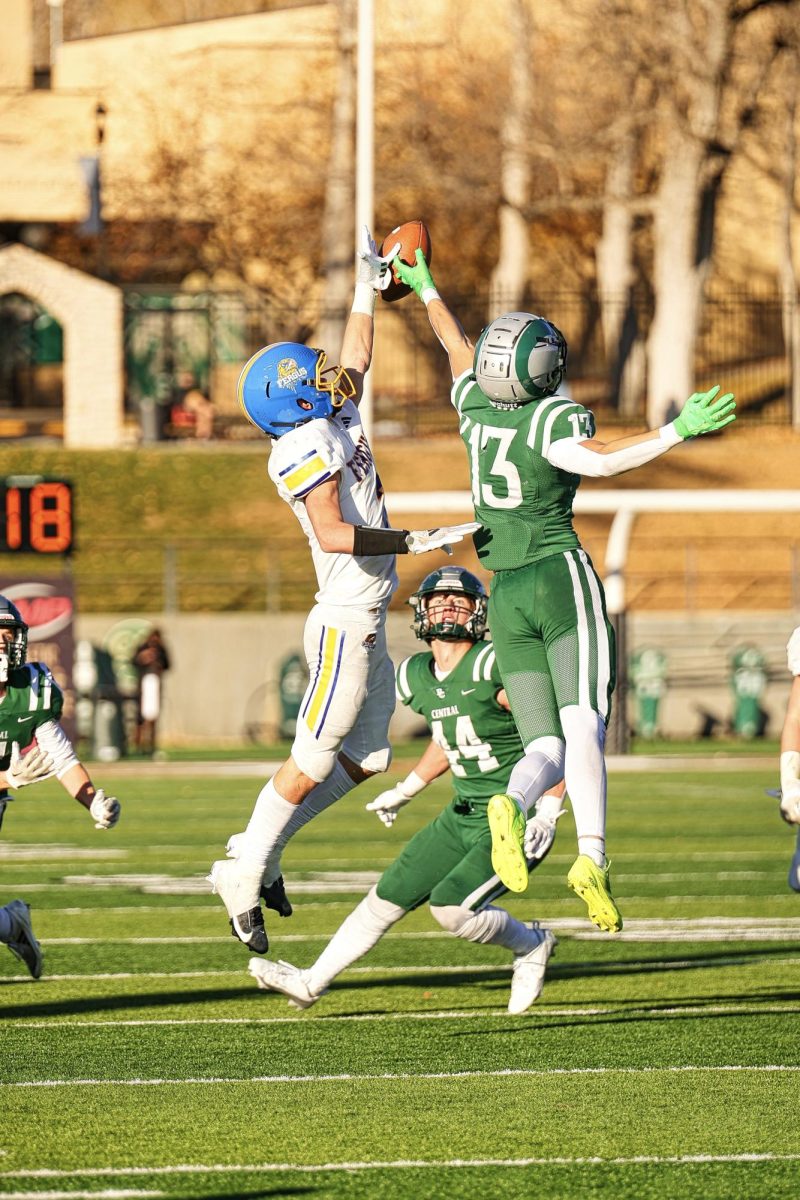 11.16.24 Junior Will Snell reaching for the ball during the game between Fergus and Billings Central. 