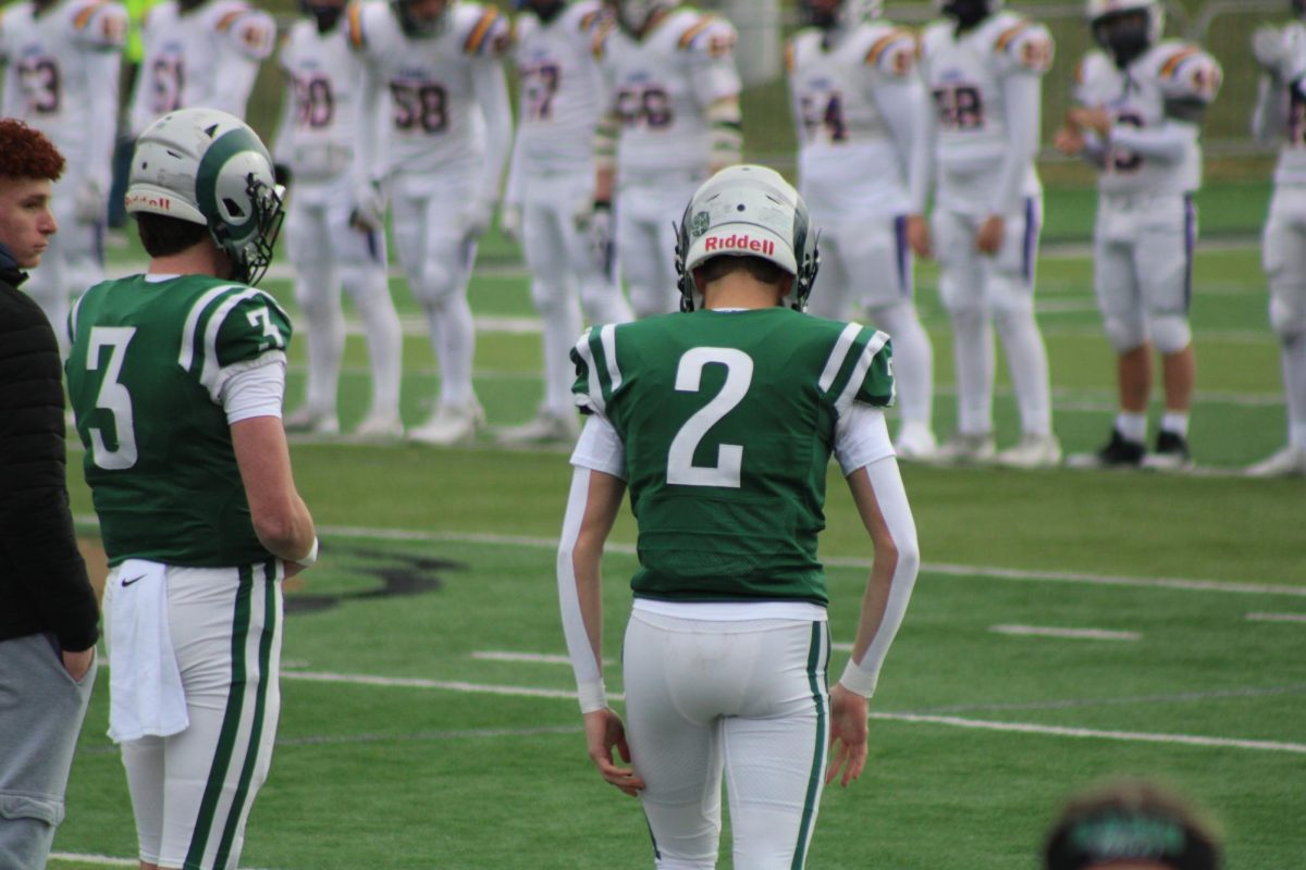 11.23.24
L- #3 Howie Martin 
Liam Aldrich walks to meet with another Laurel player as lineups are called.