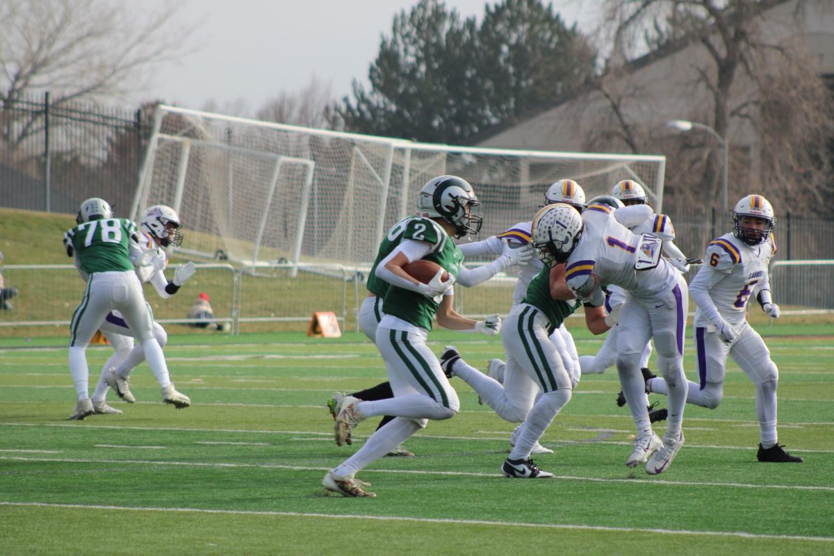 11.23.24 
Liam Aldrich runs the ball in the Billings Central v Laurel state championship game 